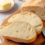 Freshly baked French bread on a wooden table