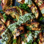 Delicious Green Goddess Chicken garnished with fresh herbs and veggies