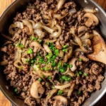 Ground beef cooked with onions and mushrooms in a savory dish