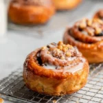 Freshly baked homemade cinnamon rolls with icing, ready to enjoy.