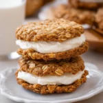Homemade oatmeal cream pies with creamy filling between soft cookies