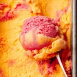 Delicious mango strawberry frozen yogurt in a colorful bowl