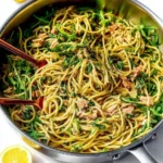 Delicious Mediterranean Tuna Pasta garnished with fresh herbs and vegetables