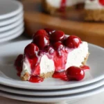 No-Bake Cherry Cheesecake topped with fresh cherries and whipped cream
