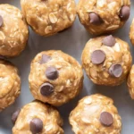 Homemade peanut butter protein balls on a wooden table