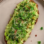 Pickled jalapeño edamame spread served with crackers.