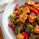Quick teriyaki tofu stir fry served in a bowl with vegetables