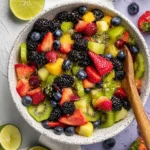 Colorful Rainbow Fruit Salad topped with Maple Lime Dressing