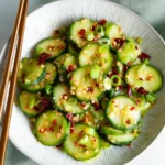 Delicious TikTok cucumber salad with fresh ingredients and vibrant colors.