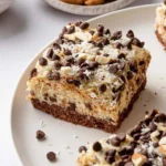 Delicious Almond Joy Cheesecake Bars with chocolate and coconut toppings.