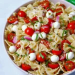 Delicious Caprese Pasta Salad with tomatoes, mozzarella, and basil