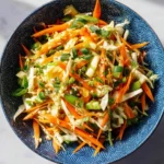 Bowl of colorful Carrot Cabbage Salad with fresh vegetables