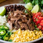 Delicious Chipotle Barbacoa beef served in a taco with fresh toppings.