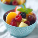 Colorful fruit salad with a variety of fresh fruits in a bowl