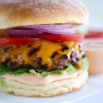 Delicious gourmet burger served with fresh toppings and condiments