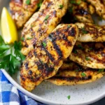 Grilled chicken tenders served with fresh vegetables and dipping sauce.