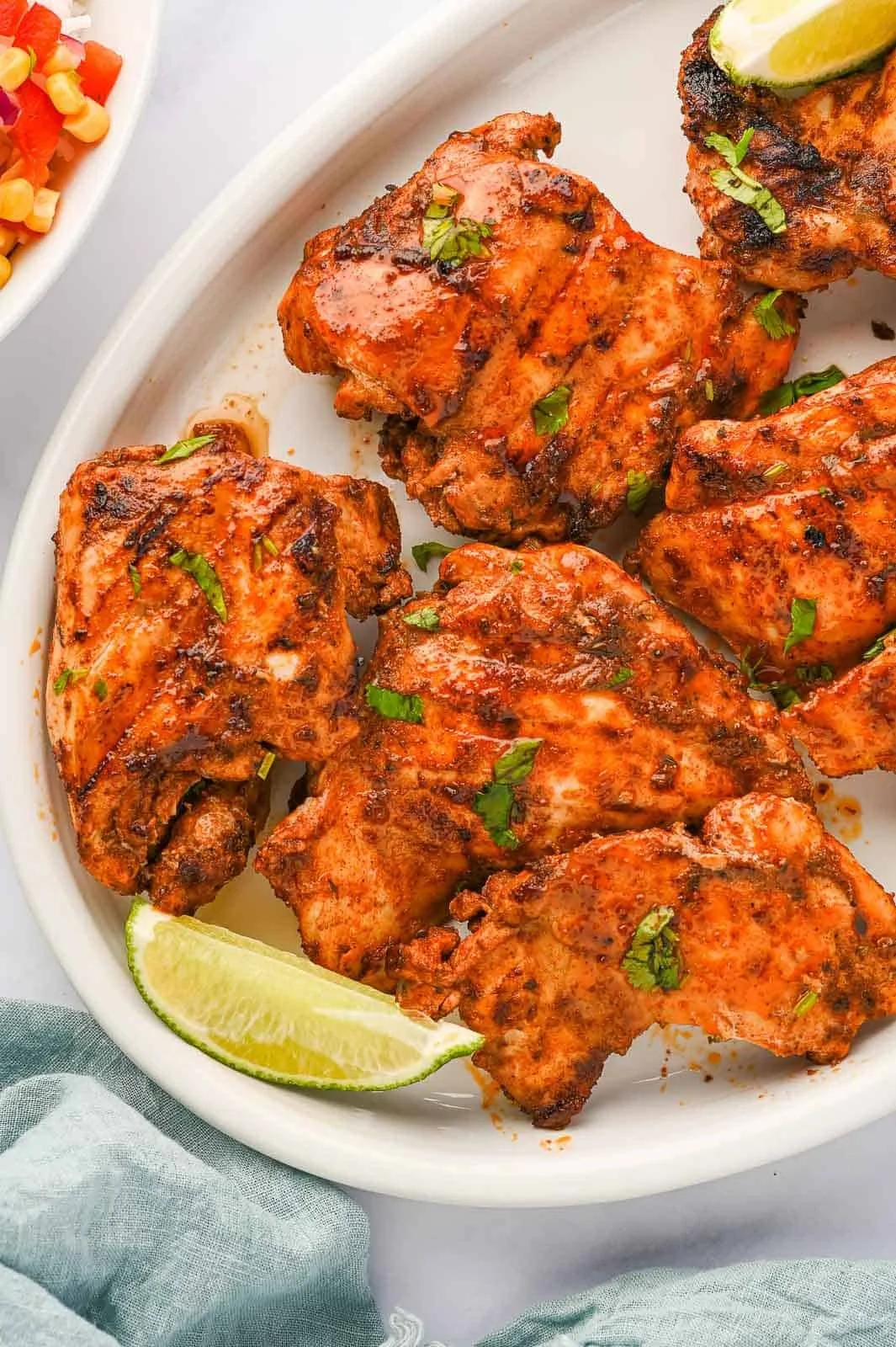 Delicious grilled roast chicken garnished with herbs and spices