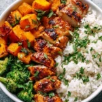 Delicious Hot Honey Chicken Bowls served in a bowl with vibrant vegetables.