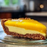 Delicious creamy mango pie topped with fresh mango slices