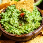 Bowl of my favorite guacamole recipe with fresh ingredients
