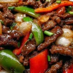 Pepper steak stir-fry featuring colorful vegetables and tender beef strips