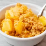 Delicious Pineapple Cheese Casserole served in a baking dish