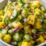 Fresh Pineapple Cucumber Salad with vibrant fruits and greens