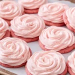 Pink lemonade cookies with a vibrant pink color and lemon zest icing
