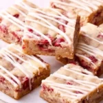 Delicious Raspberry White Chocolate Blondies served on a plate