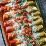 Plates of red and green enchiladas garnished with fresh herbs and cheese.
