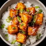 Delicious sweet and sour tofu dish made with honey served on a plate