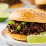 Asian Sloppy Joes served on a bun with vibrant toppings