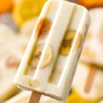 Delicious banana pudding popsicles served on a wooden stick