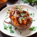 BBQ Chicken Twice Baked Sweet Potatoes topped with cheese and herbs