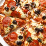 Delicious Chicken Crust Pizza topped with fresh vegetables and cheese