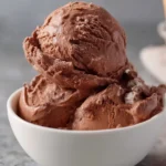 Chocolate Malted Crunch ice cream in a bowl with chocolate sprinkles