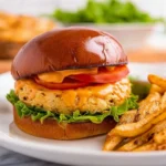 Delicious crab cake sandwich served with fresh toppings and zesty sauce