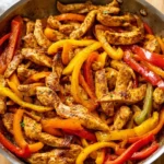 Delicious 30-minute chicken fajitas served with peppers and onions
