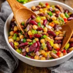 Colorful Easy 5 Bean Salad with fresh vegetables and dressing