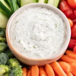 Creamy veggie dip served with fresh vegetables for a healthy snack.