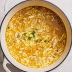 Bowl of homemade Egg Drop Soup garnished with green onions
