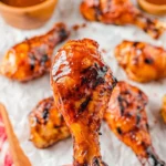 Delicious grilled BBQ chicken drumsticks ready to serve