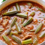 Bowl of hearty okra stew filled with fresh vegetables and spices
