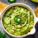 Bowl of homemade guacamole made with fresh avocados and spices