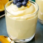 Delicious lemon mousse dessert garnished with fresh lemon zest.