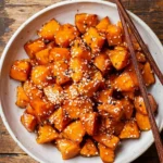 Miso glazed sweet potatoes drizzled with savory sauce