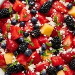 Red, White, and Blue Fruit Salad for a festive celebration with fresh berries and fruit.