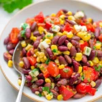 Healthy Skinny Mexican Bean Salad with Corn featuring beans, corn, and fresh veggies.