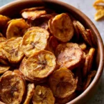 Crispy air fryer banana chips served in a bowl