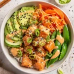 Healthy air fryer salmon bowls with fresh vegetables and grains